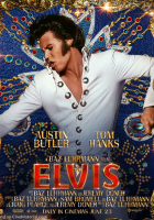 Elvis: man with black hair in a white suite looking to the side.